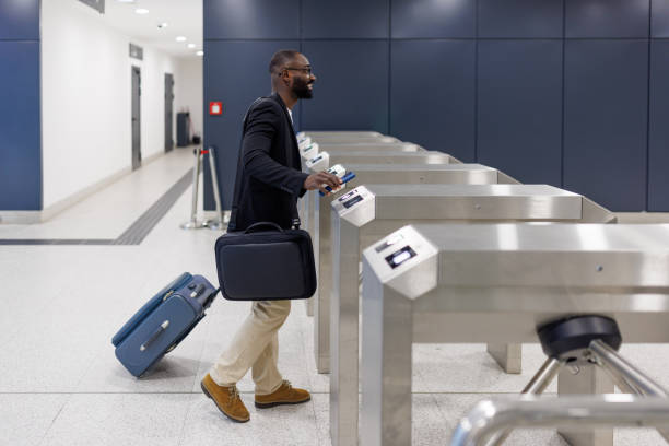 istock Businessman passing through electronic turnstile gate at airport 2192657790