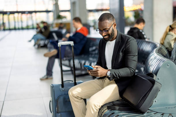 istock Businessman using smartphone while waiting at the airport 2192657985