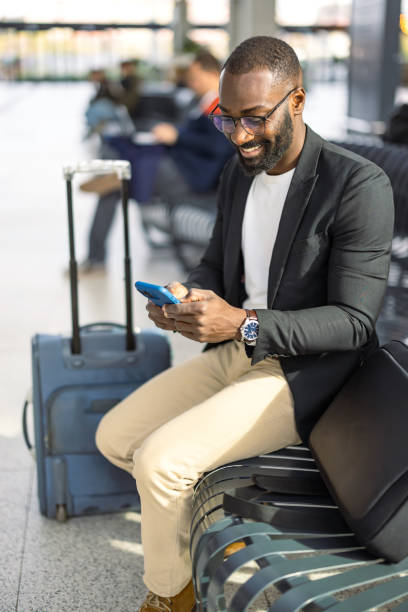 istock Businessman using smartphone while waiting at the airport 2192657986