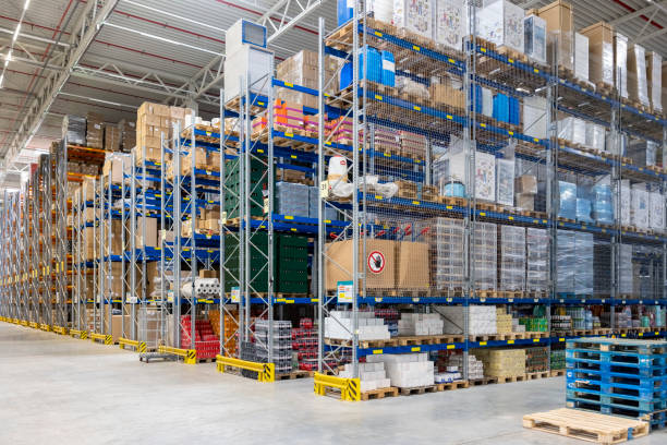 istock Large warehouse storage facility with shelves of goods 2192659635