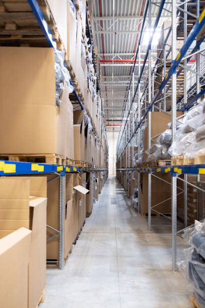 istock Large distribution center with stacks of products on racks 2192659785