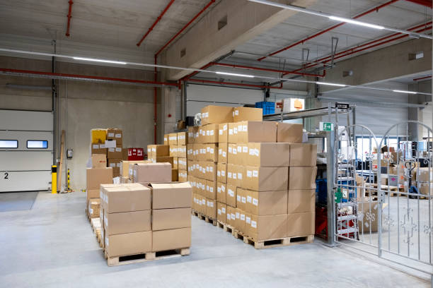 Cardboard boxes on wooden pallets at warehouse loading dock