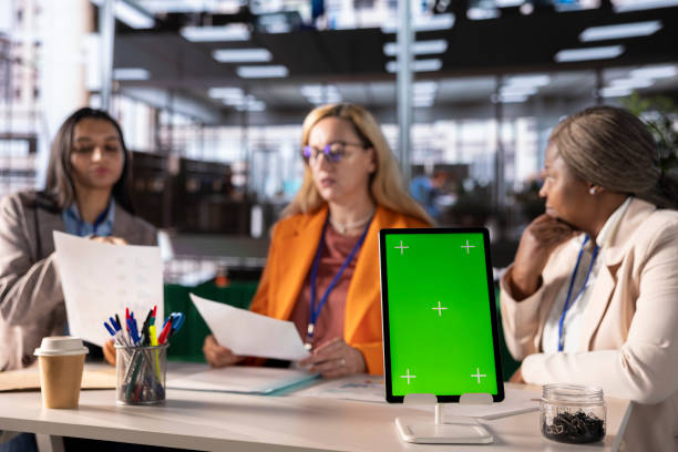 istock Entrepreneurs team with a success story work next to green screen 2192659998