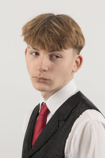 istock Teenage boy wearing a suit 2192660036