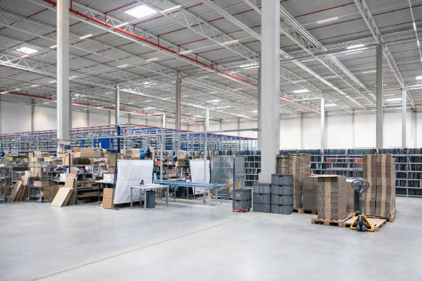 istock Products packaging stations in large warehouse interior 2192660172