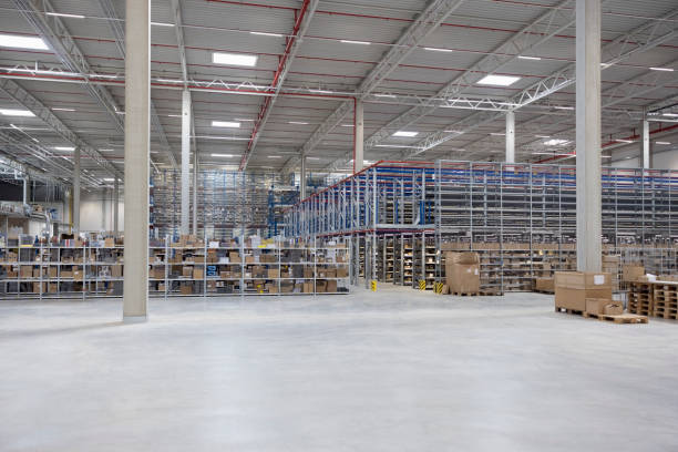 istock Modern shipping company warehouse with organized racks 2192660319