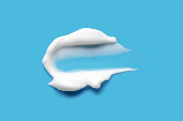 istock A sample of white cosmetic moisturizer on a blue background 2192661292