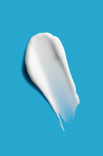 istock A sample of white cosmetic moisturizer on a blue background 2192661295