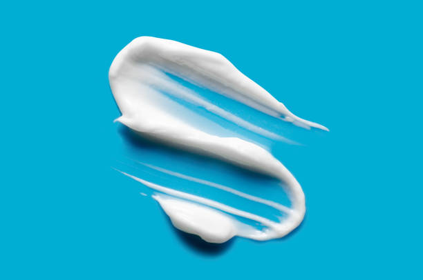 istock A sample of white cosmetic moisturizer on a blue background 2192661296