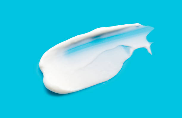 istock A sample of white cosmetic moisturizer on a blue background 2192661459