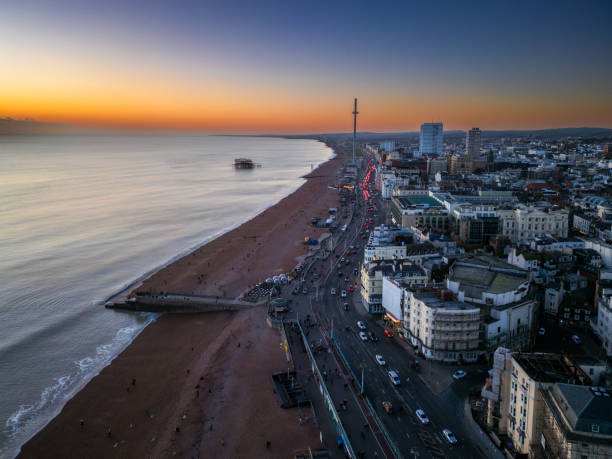Aerial view taken by drone depicting the architecture of the English coastal city of Brighton, including regency-style residential buildings.