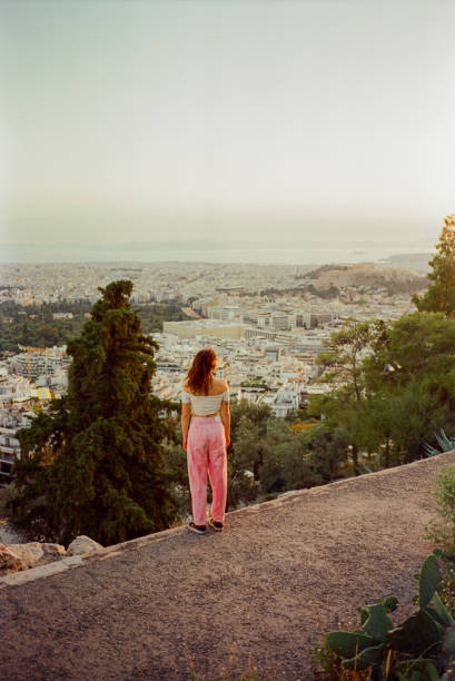 istock Woman looking at Athens cityscape from viewpoint 2192663087