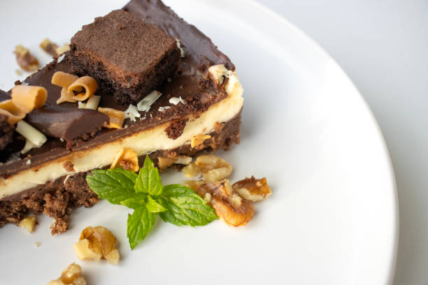 Freshly made chocolate brownies served with raspberries on the top