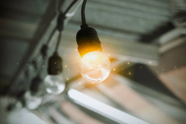 Abstract light bulb with digital earth and circuit design, representing global technology and innovation