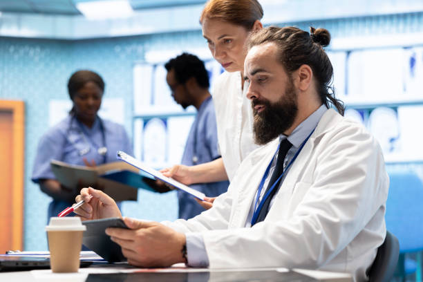 istock Experts team examine test results scans to develop treatment service 2192666249