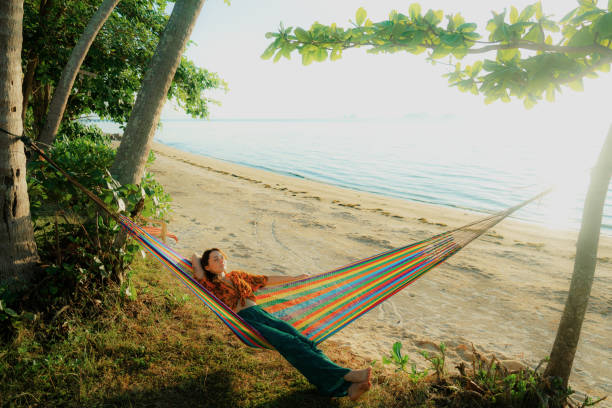 istock Woman resting in hammock at tropical beach on Ko Samui island 2192666382