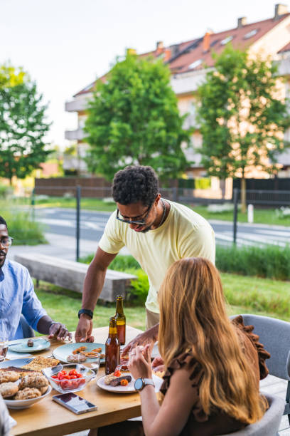 istock Dark-Skinned Man Holding A Plate With Snacks During A Lunch Outside 2192666717