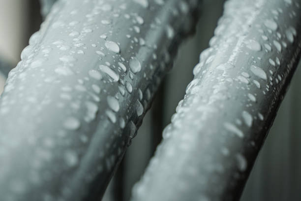 A raindrops on a black railing