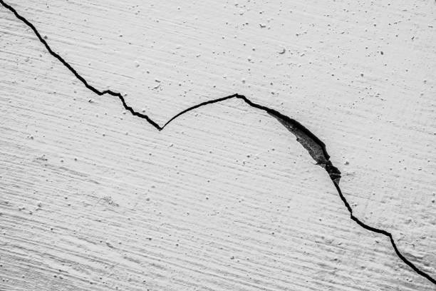 istock Cracked white walls caused by earthquake or other disaster 2192672790