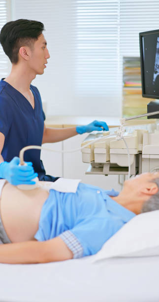 istock elder receive abdominal ultrasound 2192678393