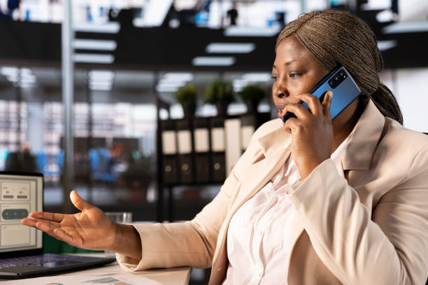 istock Manager talking on phone with partners to analyze sales performance metrics 2192678453