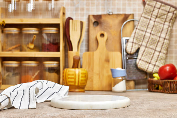 istock Kitchen brass utensils, chef accessories. wood tabletop with white marble board with napkin 2192679263