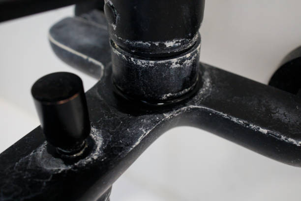 istock Intense limescale on a black bathroom faucet close up 2192679882