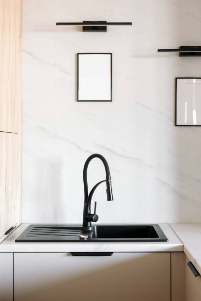 istock Modern black sink and faucet in a stylish kitchen interior design 2192680596