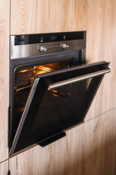 istock Modern kitchen interior showcasing a built-in oven with contemporary design elements 2192680602
