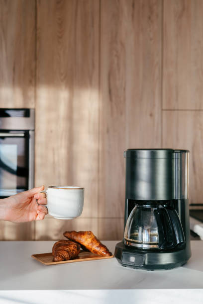 istock Cozy morning routine with freshly brewed coffee and warm croissants in a kitchen 2192680606