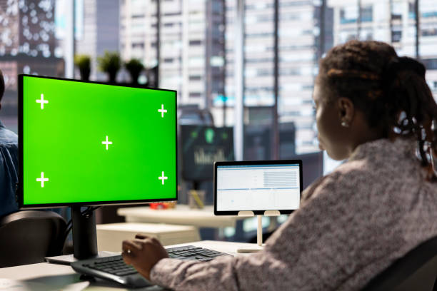 istock Female executive seated at her workstation with isolated copy space multitasking 2192680844