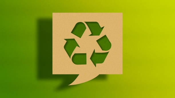 istock Recycling Concept - Cardboard Speech Bubble with Recycling Symbol on Green Background 2192680940