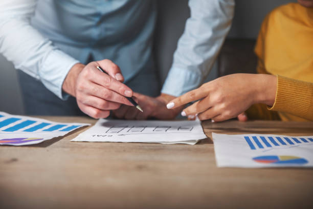 istock business team discussing charts with graphs and charts 2192683798