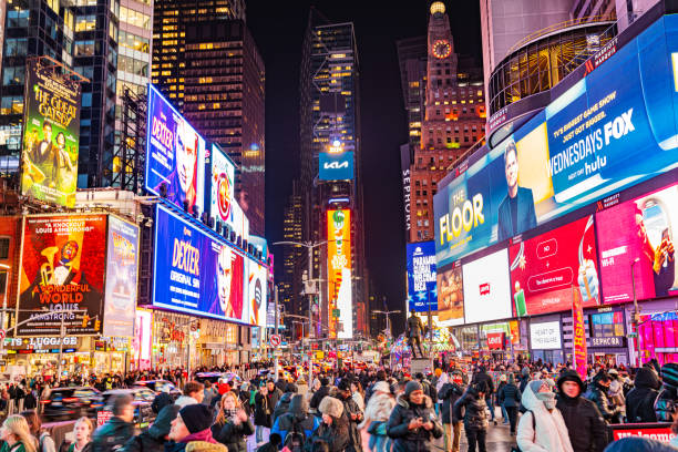 istock Vibrant Night at Times Square New York with Crowds and Illuminated Billboards 2192683838