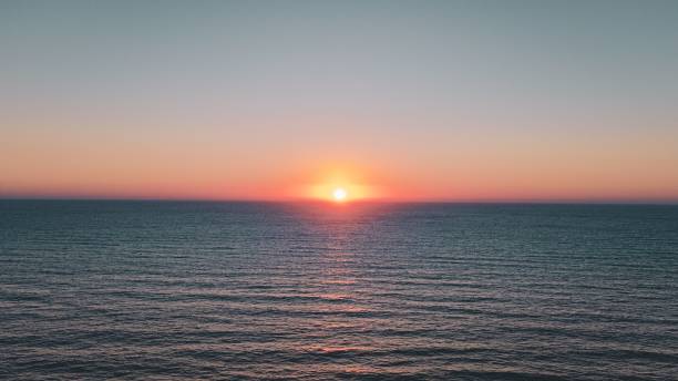 istock Serene ocean sunset with vibrant sky colors. 2192687745