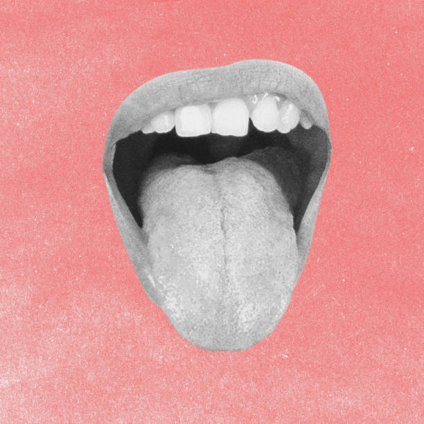 istock Woman lips with visible teeth showing tongue 2192690347