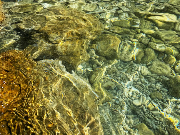 istock Stones and pebbles in sea crystal clear water. 2192691865