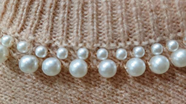istock Sweater collar detail embroidered with white pearls. 2192693986