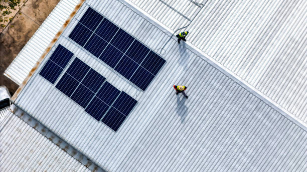 istock A sustainable energy project featuring solar panels on a roof surrounded by tropical trees, highlighting renewable energy efforts and the integration of green technology into rural areas. 2192694145