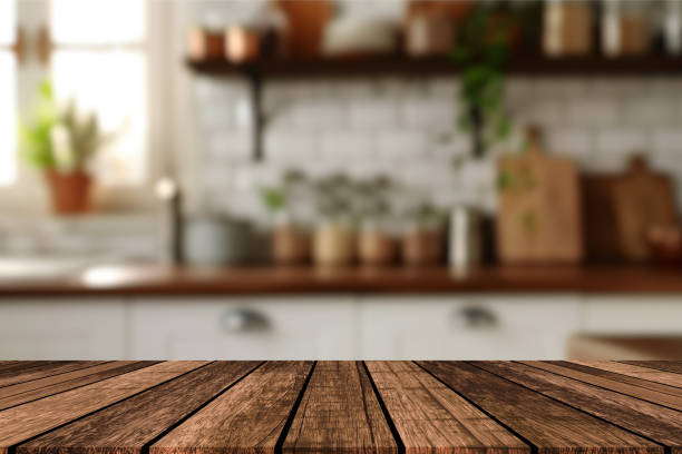 istock Empty beautiful wood table top counter and blur bokeh modern kitchen interior background in clean and bright,Banner, Ready for product montage 2192699862