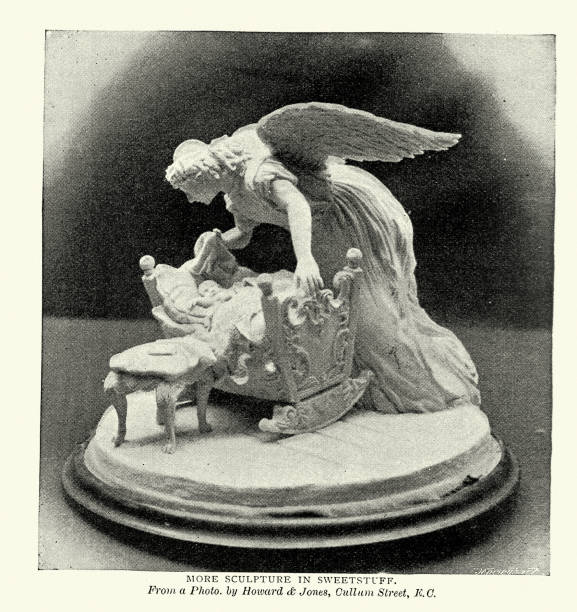 Sculpture of a Guardian angel leaning over a babies cot, carved from sugar, 1890s 19th Century Vintage photograph