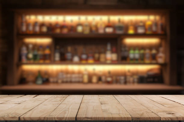 istock Liquor bar background in softfocus with wooden table 2192699893