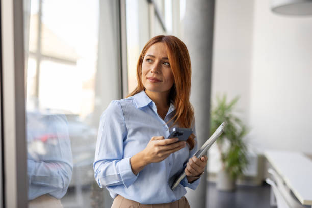 istock Confident businesswoman with technology in her hands 2192700038