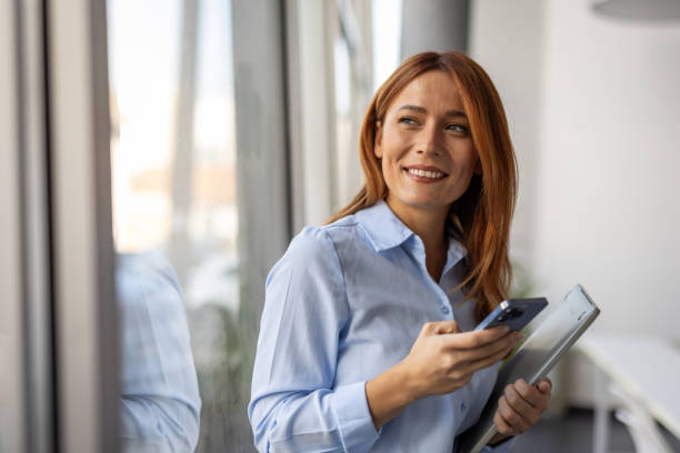 istock Confident businesswoman with technology in her hands 2192700055
