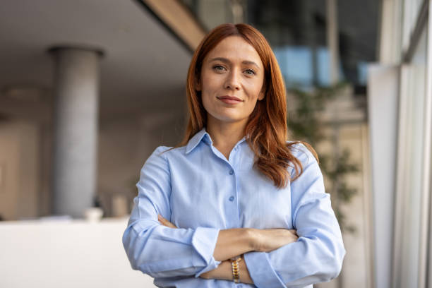 istock Professional woman standing with crossed arms 2192700165
