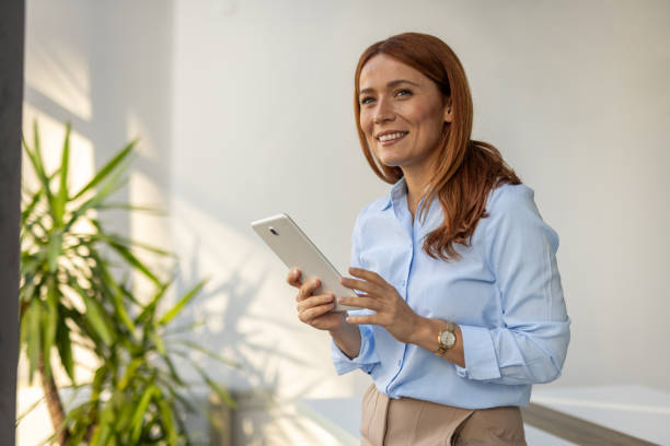 istock Businesswoman exploring ideas on her tablet at work 2192700316