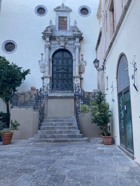 istock Stone stairs leading up to decorated door with pillars and shield 2192700854