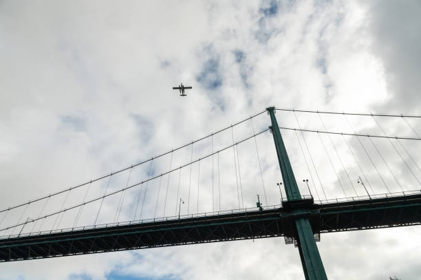 istock Seaplane flies over Lions Gate Bridge 2192701092