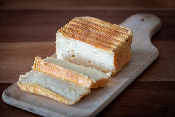 istock Sliced Limburger or Herve cheese on wooden plank 2192701114