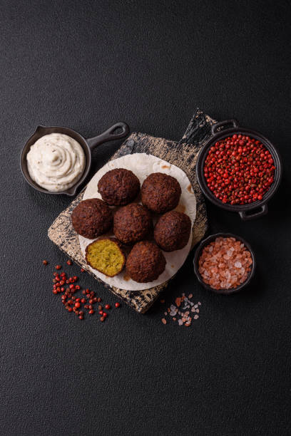 istock Fried chickpea falafel balls with salt, spices and herbs 2192702351